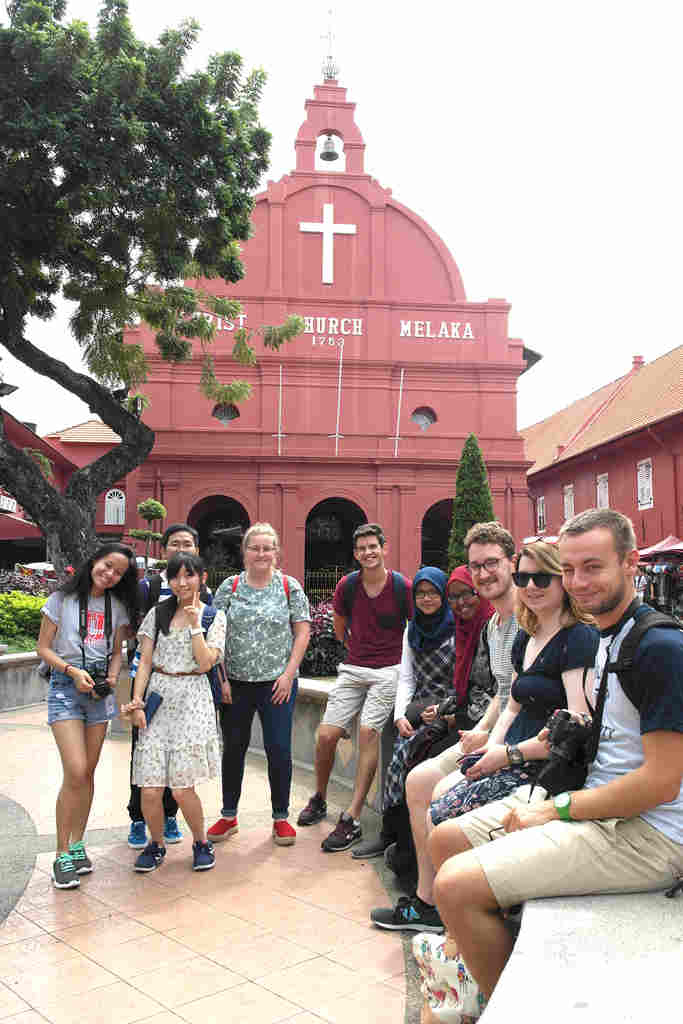 Exchange students outside Christ Church in Malacca. Built by the Dutch in 1753, and named Bovenkerk (High Church), after the signing of the Anglo-Dutch Treaty of 1824, it was re-named by the Church of England
