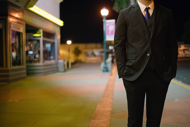 Man dressed in suit on street